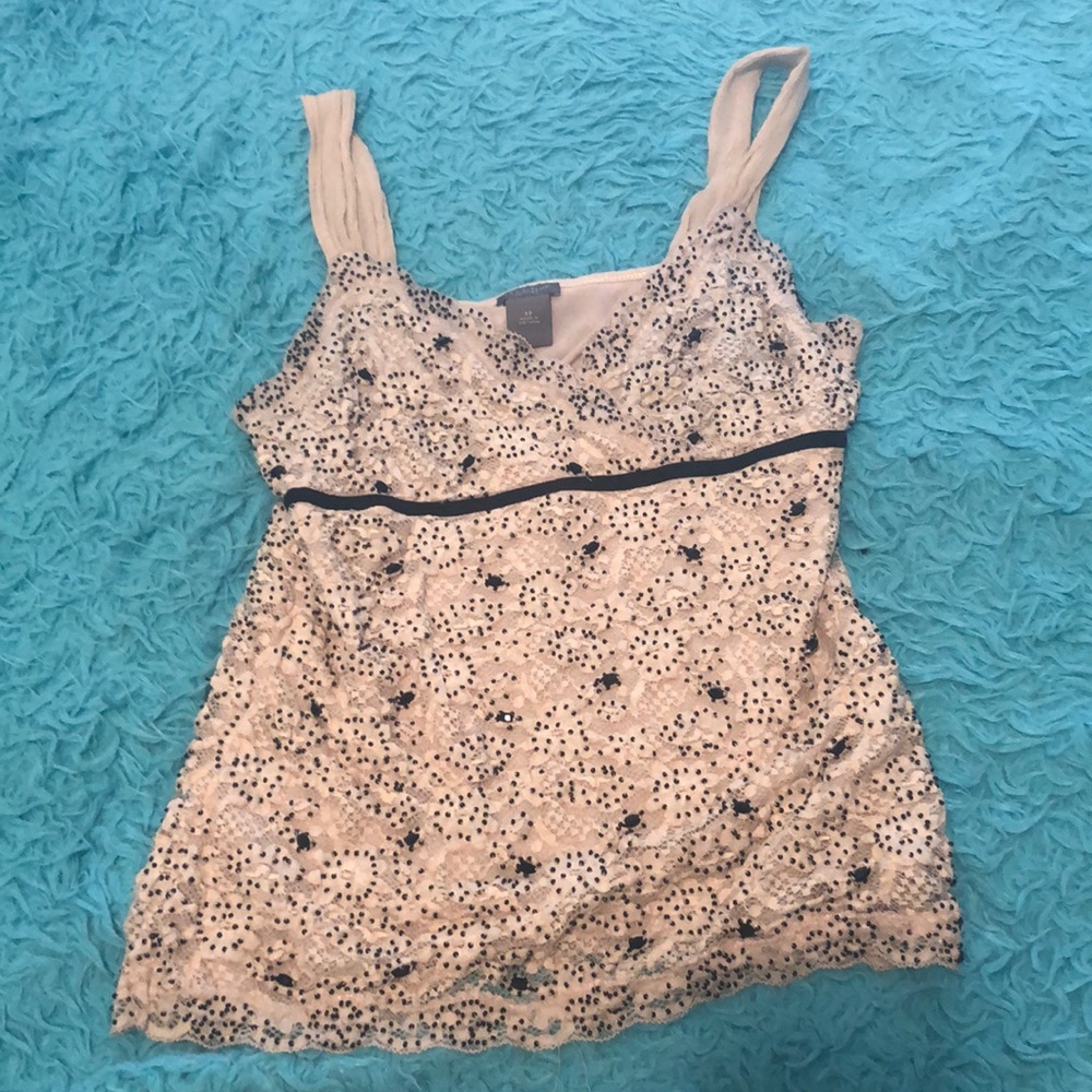 I’m selling a white shirt with some black beads